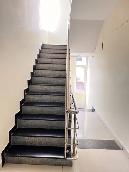 Hallway, stairs and lobby at 7 Hills Service Apartments